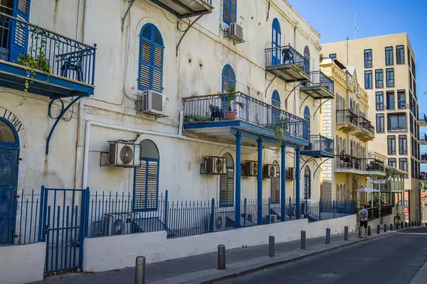 Restored Templar house with blue balconies on a street in the American-German Colony, Tel Aviv