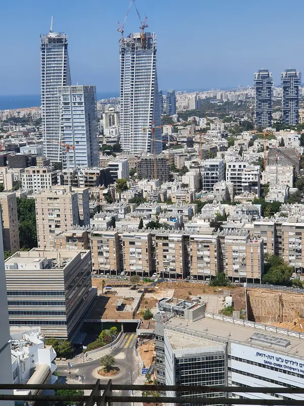 Aerial view of the Kikar HaMedina towers over the low Bauhaus rooftops of the New North