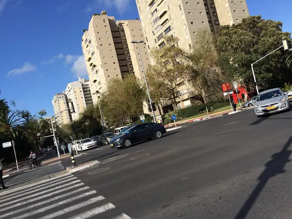 Residential apartment towers and a wide crossing in the Ramat Aviv Gimel sub-neighbourhood
